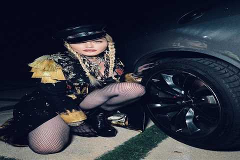 Madonna, 63, strikes a cheeky pose after running into car trouble