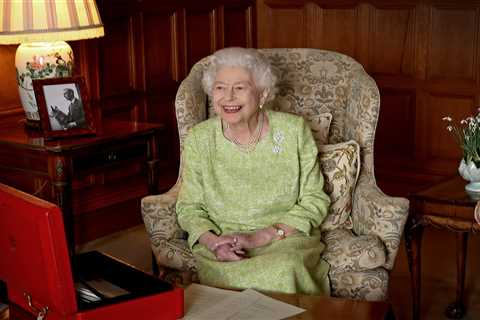 Queen beams with pride as she celebrates 70 years on the throne next to picture of her beloved..