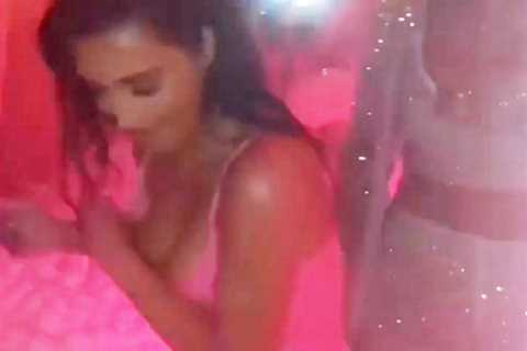 Kim Kardashian has near wardrobe malfunction as she desperately tries to keep her boobs from..