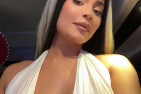 Kylie Jenner shows off major cleavage & her famous curves in a very low-cut top for new..