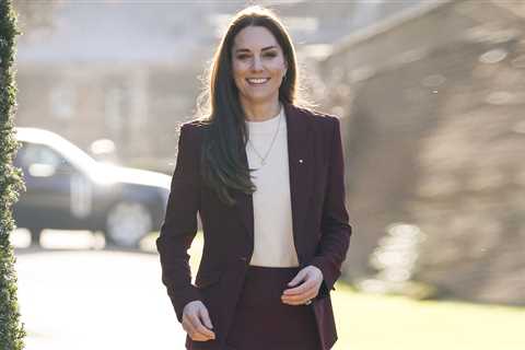 Kate Middleton lets slip that Louis is mad about rugby as she looks sharp in a burgundy suit