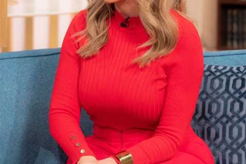 Carol Vorderman wows This Morning viewers in a red catsuit and white knee-high boots