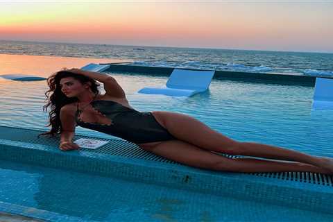 Towie star Yaz Oukhellou shows off her curves in plunging swimsuit