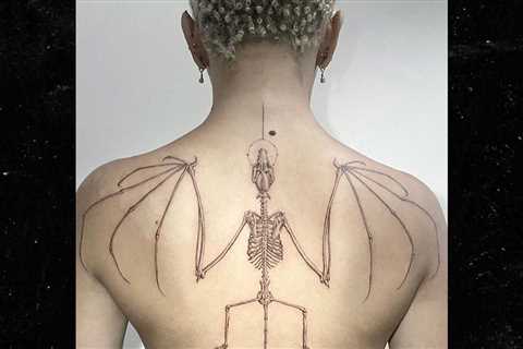 Doja Cat Gets New Bat Skeleton Tattoo After Unveiling Monster Ink