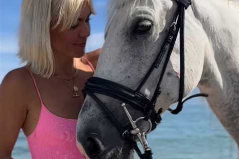 A Place In The Sun’s Danni Menzies wows in pink swimsuit as she rides a horse into the sea in Corfu