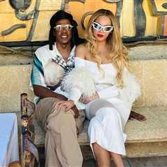 Fashion Bomb Couple:  Beyoncé Wore a White Feathered LaPointe Dress and Brandon Blackwood handbag..