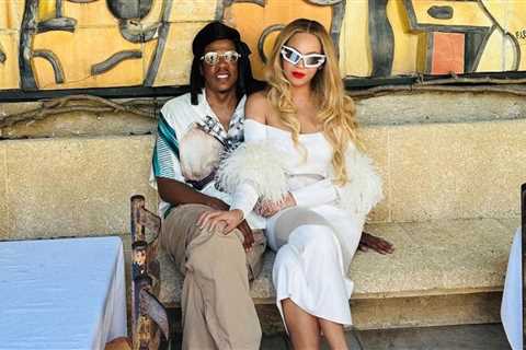 Fashion Bomb Couple:  Beyoncé Wore a White Feathered LaPointe Dress and Brandon Blackwood handbag..