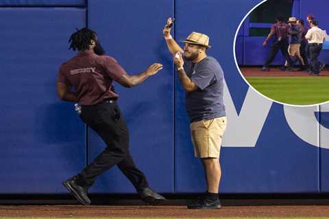 Fan escorted off field after apparent fall during Mets-Giants at Citi Field in bizarre scene