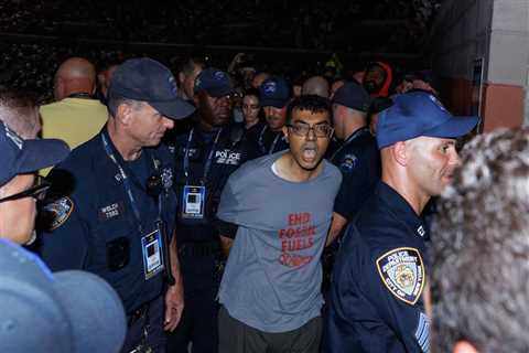 US Open semifinal delayed by climate protesters, including one who glued themselves to ground