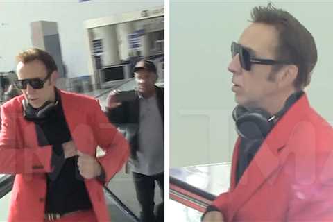 Nicolas Cage Rocks Red Christmas Suit at LAX