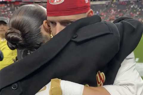 Olivia Culpo and Christian McCaffrey hug before Super Bowl 2024