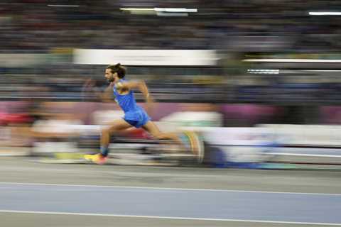 Italian Olympian breaks high-jump record before faking injury, jokingly pulling springs from shoe:..