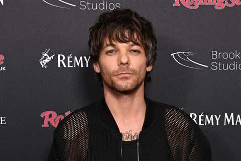 Louis Tomlinson Greeted as Hero After Setting Up TV at Glastonbury Festival to Screen England’s..