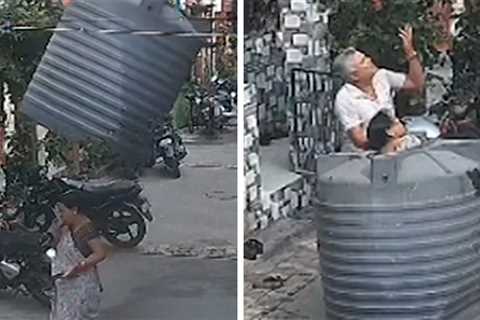 Lucky Landing Saves Woman From Falling Water Tank on Street, on Video