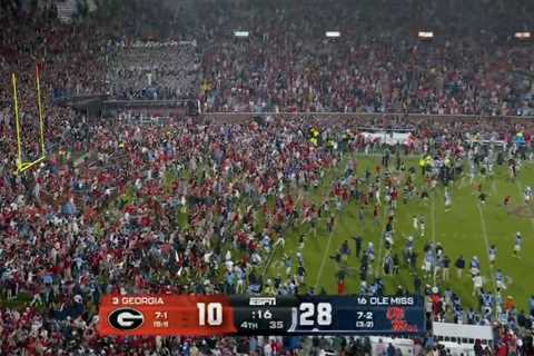 Ole Miss fans storm field with time remaining on clock, prompting delay to game’s end