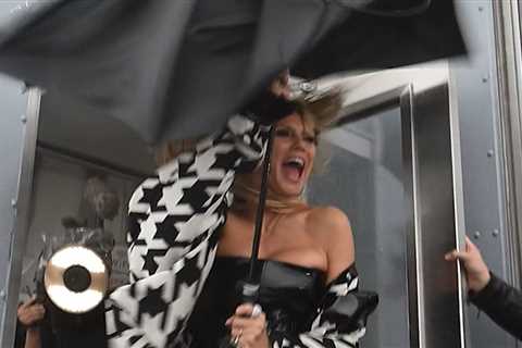 Heidi Klum Struggles With Umbrella in Gale Force Wind on NYC Rooftop, on Video