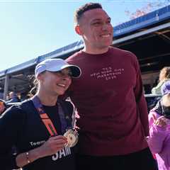 Aaron Judge hugs wife Samantha after she completes 2025 NYC Marathon