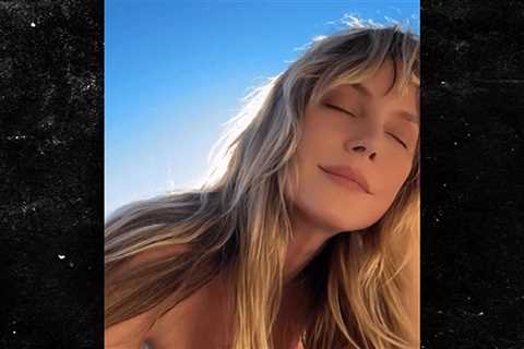 Heidi Klum Tans Topless, on Video