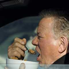 William Shatner Photographed Eating Bowl of Cereal in His Car at Stop Light