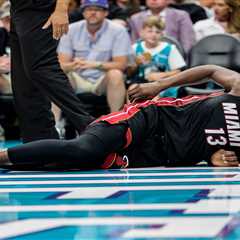 Bam Adebayo exits play-in game with back injury after Lamelo Ball grabs his ankle in tie-up