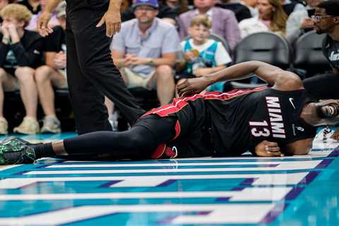 Bam Adebayo exits play-in game with back injury after Lamelo Ball grabs his ankle in tie-up