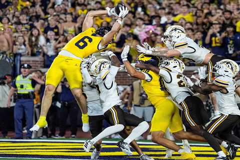 Michigan wins on second Hail Mary pass in controversial ending to avoid brutal upset